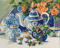 Steeping in savored charm, this blue and white Needlepoint still life seems to come alive with the bright peach begonias and pretty purple pansies amid a beautiful china tea set. Stitch with memories of sharing tea with a friend and re-living the good times that always brew at Tea Time. This needlepoint piece is designed by Nancy Rossi. Each kit contains 12-mesh needlepoint printed canvas, wool yarn, needle, chart and instructions in English, French, Spanish and German.
