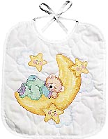 Napping on a Moon cradle! Let the stars wake your little one for a morning meal. This Neat & Nifty Stamped Cross-Stitch bib design will make an adorable gift for a new baby.