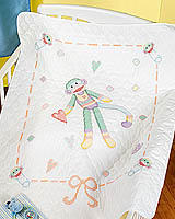 Baby Monkey Quilt is cheerful, candy-colored monkey will brighten any nursery. Stamped Cross Stitch design by Linda Gillum.