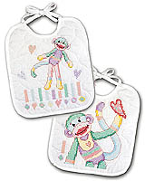 Two bibs with a cheerful candy-colored monkey. These will look great in your baby photos. Stamped Cross Stitch design by Linda Gillum.