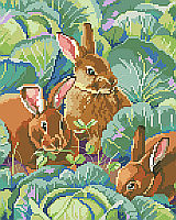 Three bunny’s nibbling clover peek out from the cabbage patch in this realistic and elegant Bunny’s Cabbage Garden design by designer Linda Gillum. 