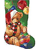 This Christmas teddy bear might be the perfect stocking for a new little kid in your family. Our bold and bright design is unusual in it's big blocks of color, but still detailed and fun to stitch. Complete with an adorable little rainbow spinning top and Christmas orbs, this stocking from Kooler doesn't lack any cuteness!
--